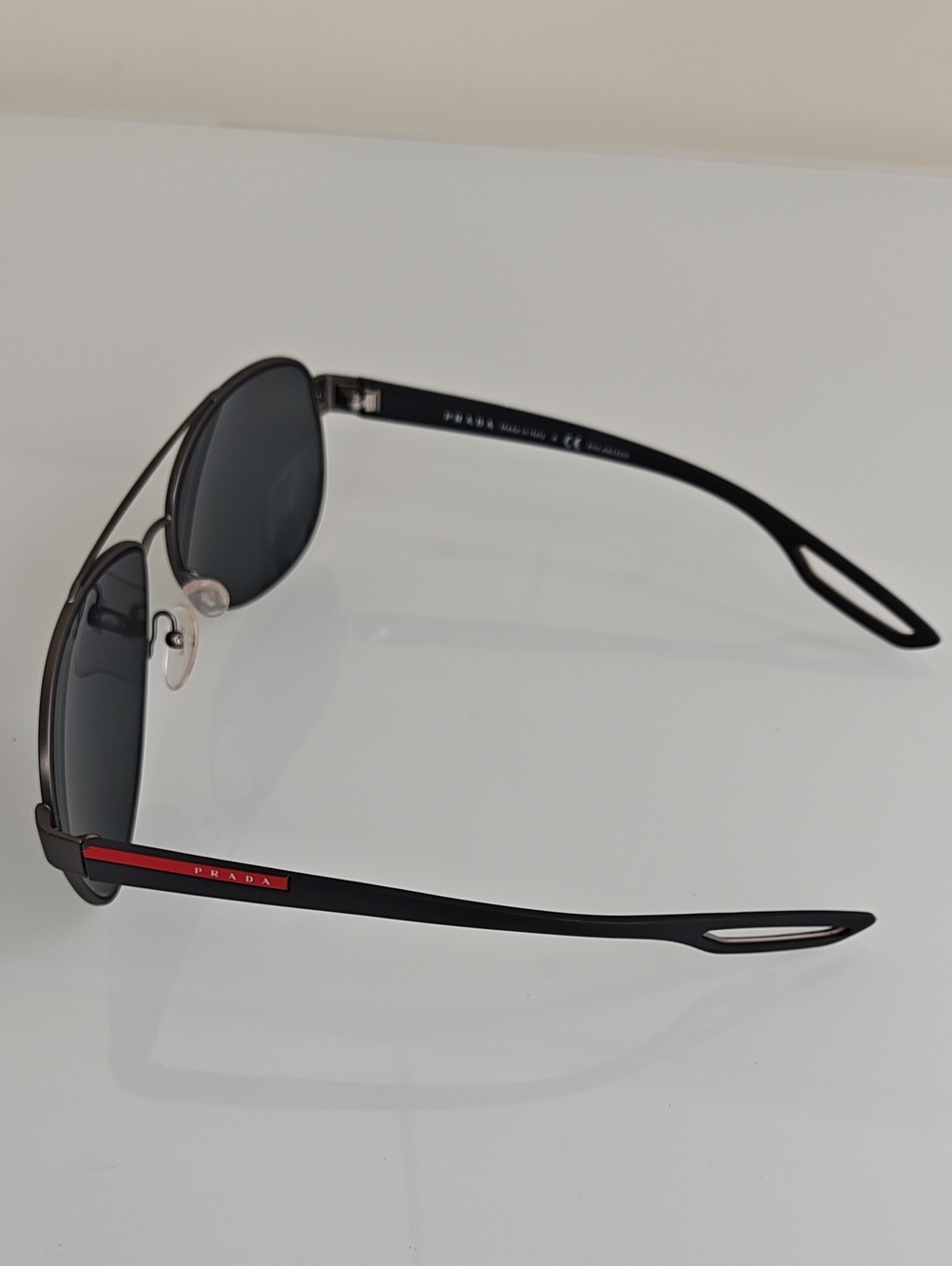 Prada Black Polarized Aviator Sunglasses with Red Temple Detail